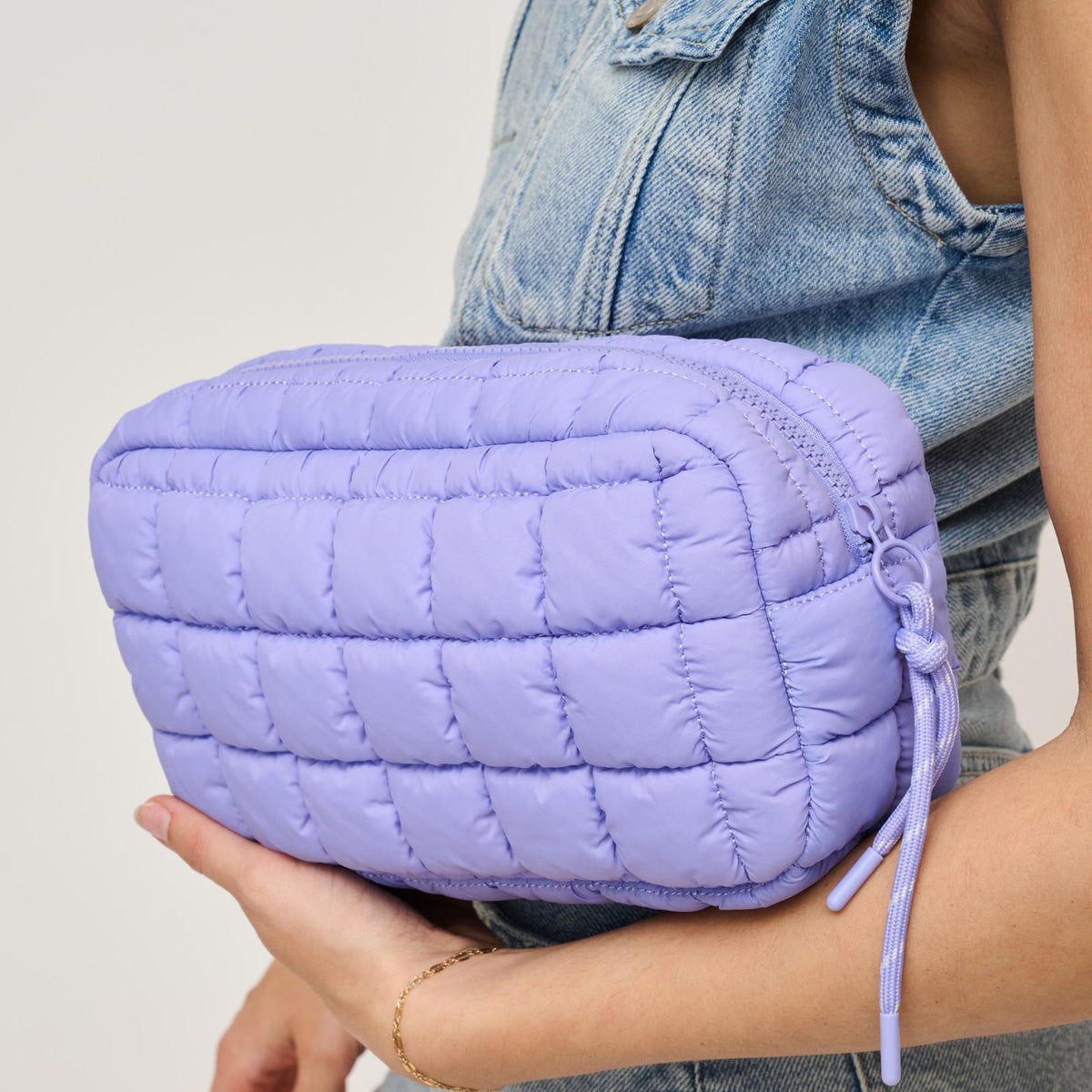 Woman wearing Periwinkle Urban Expressions Cloud Nine - Quilted Puffer Nylon Cosmetic Pouch 840611143785 View 2 | Periwinkle