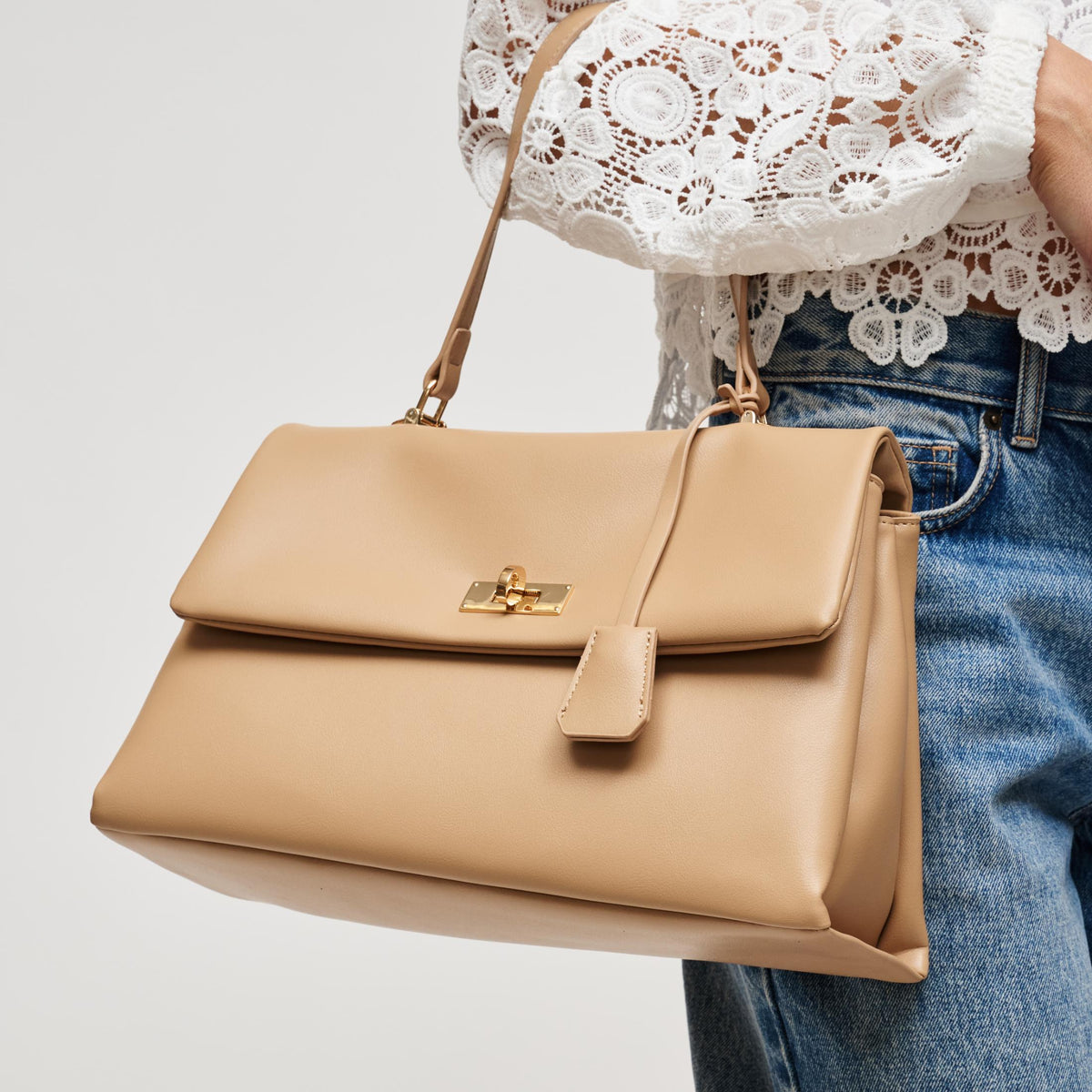 Woman wearing Natural Urban Expressions Arrow Satchel 840504212949 View 2 | Natural