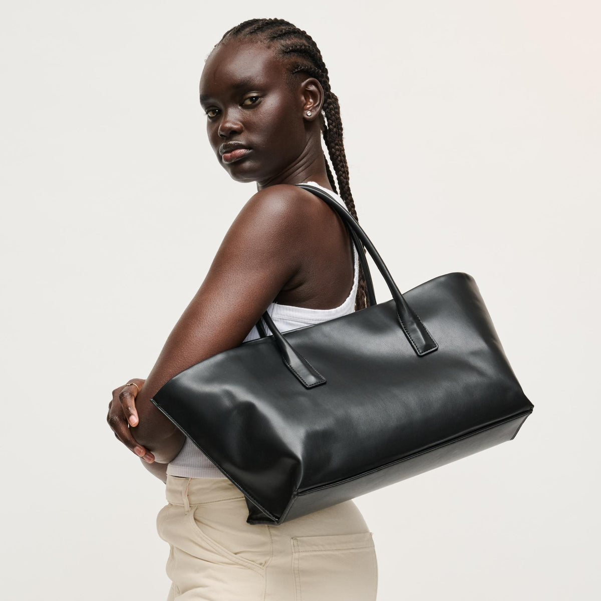 Woman wearing Black Urban Expressions Levi Tote 840504205255 View 2 | Black