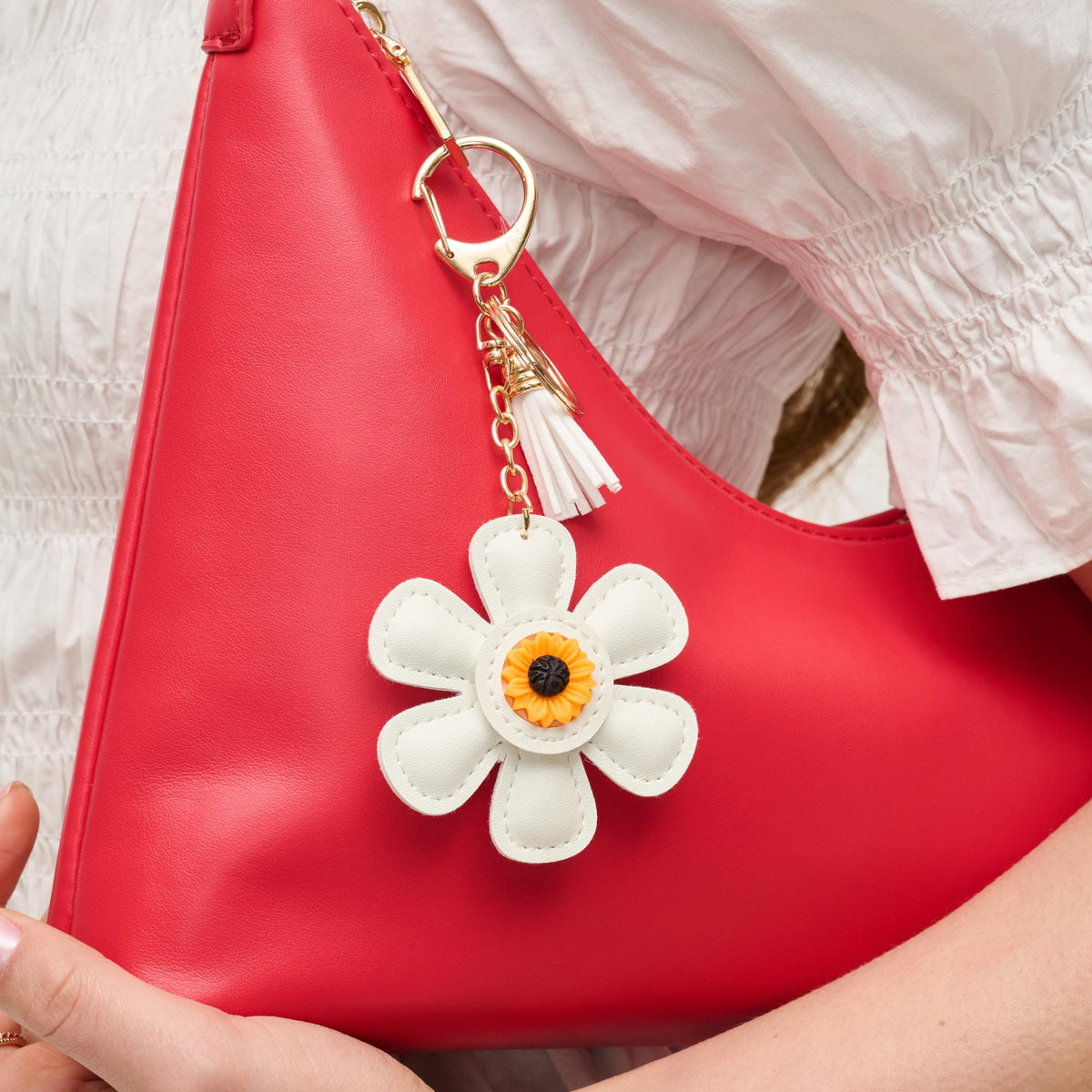 Woman wearing White Urban Expressions Floral Keychain Charm 840611150578 View 1 | White