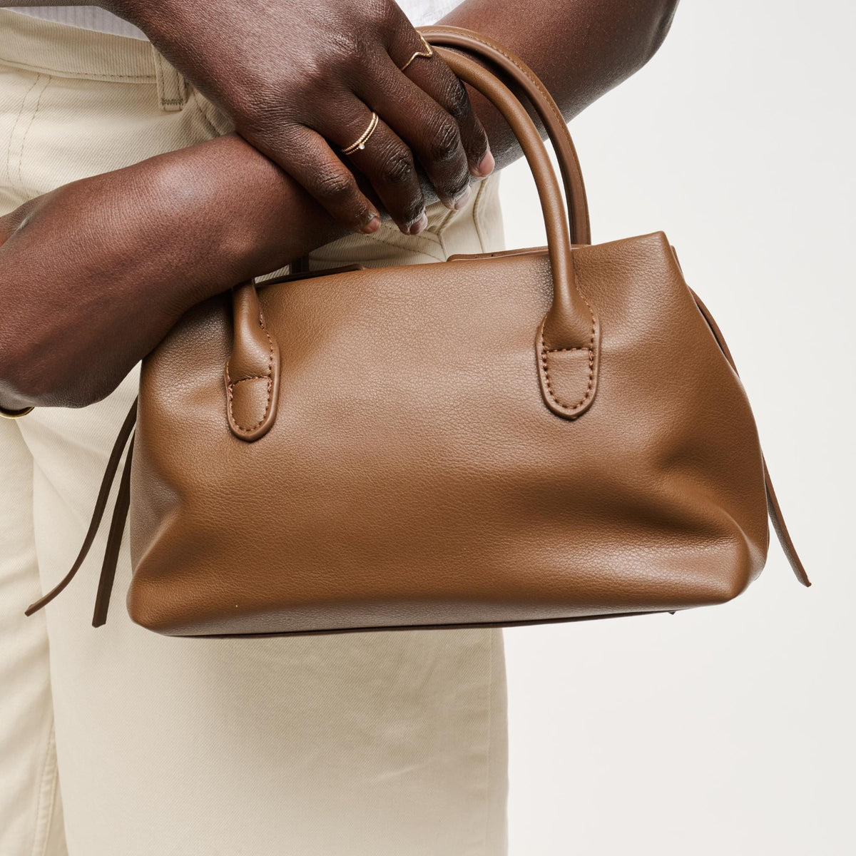 Woman wearing Chocolate Urban Expressions Logan Crossbody 840504205361 View 1 | Chocolate