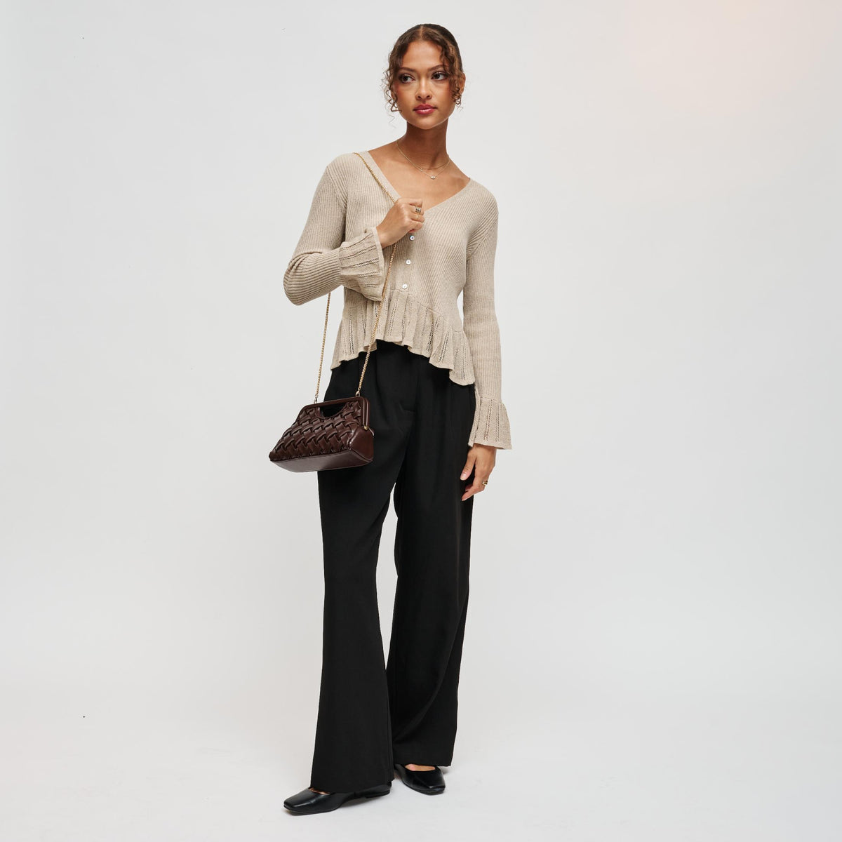 Woman wearing Chocolate Urban Expressions Alouette Clutch 840504211522 View 4 | Chocolate