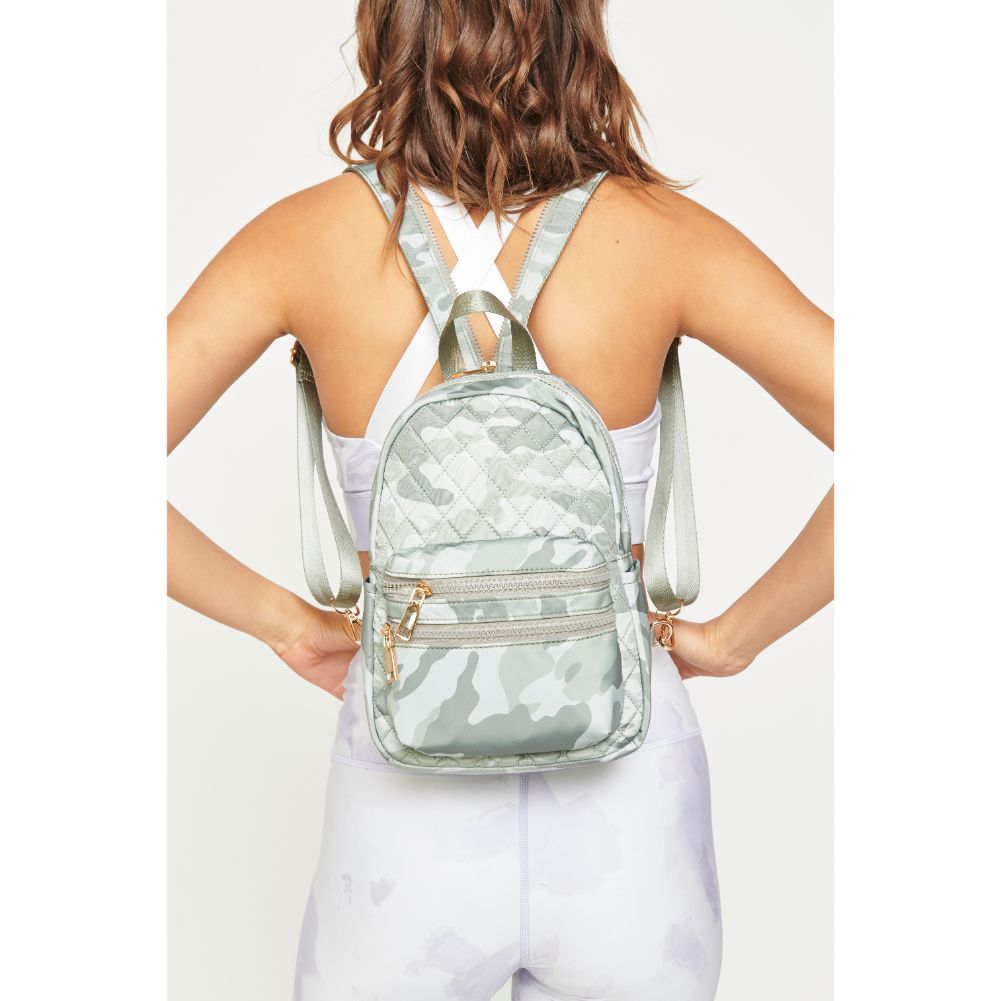 Woman wearing Sage Camo Urban Expressions Brynlee Sling Backpack 840611180476 View 1 | Sage Camo