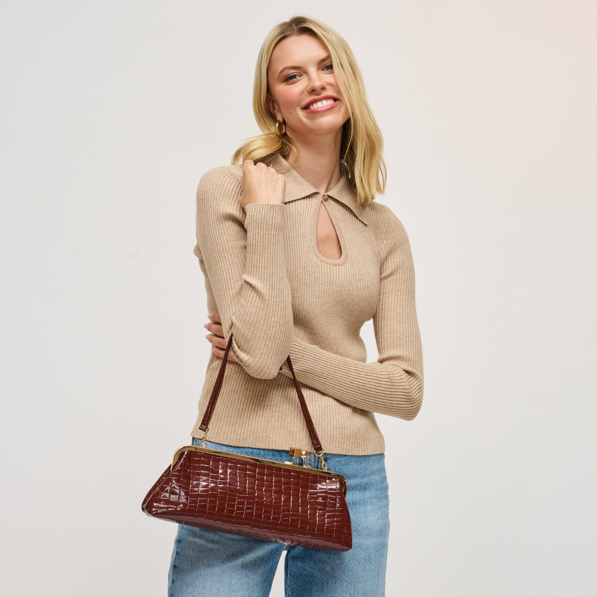 Woman wearing Chocolate Urban Expressions Piper Clutch 840504200731 View 4 | Chocolate