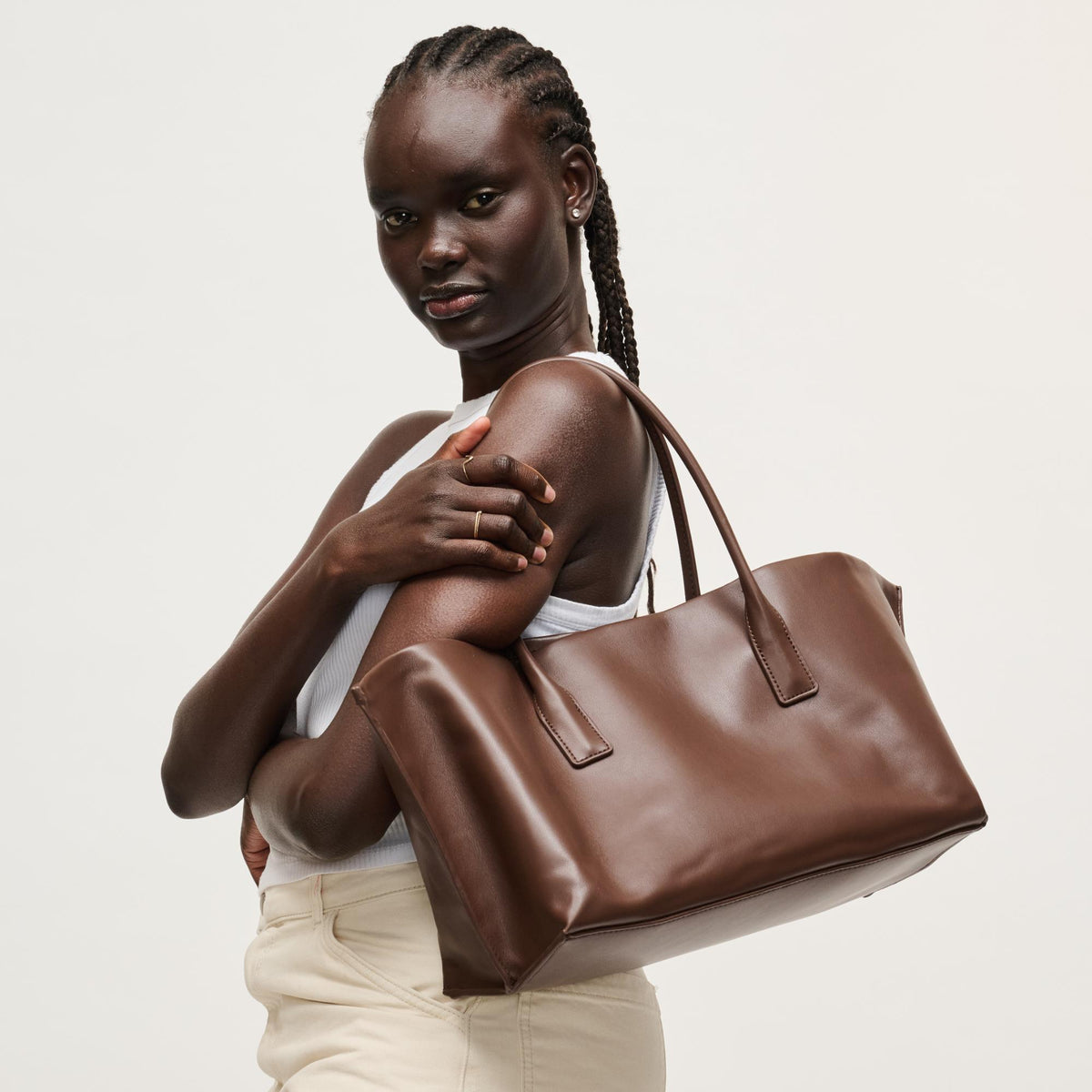 Woman wearing Chocolate Urban Expressions Levi Tote 840504205262 View 2 | Chocolate