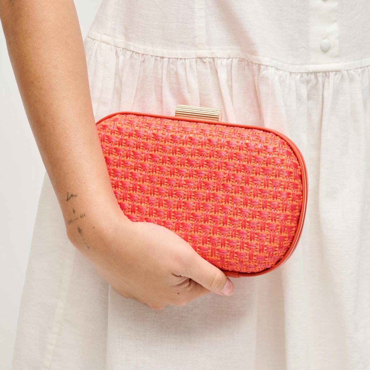 Woman wearing Coral Urban Expressions Cove Evening Bag 840504208324 View 1 | Coral