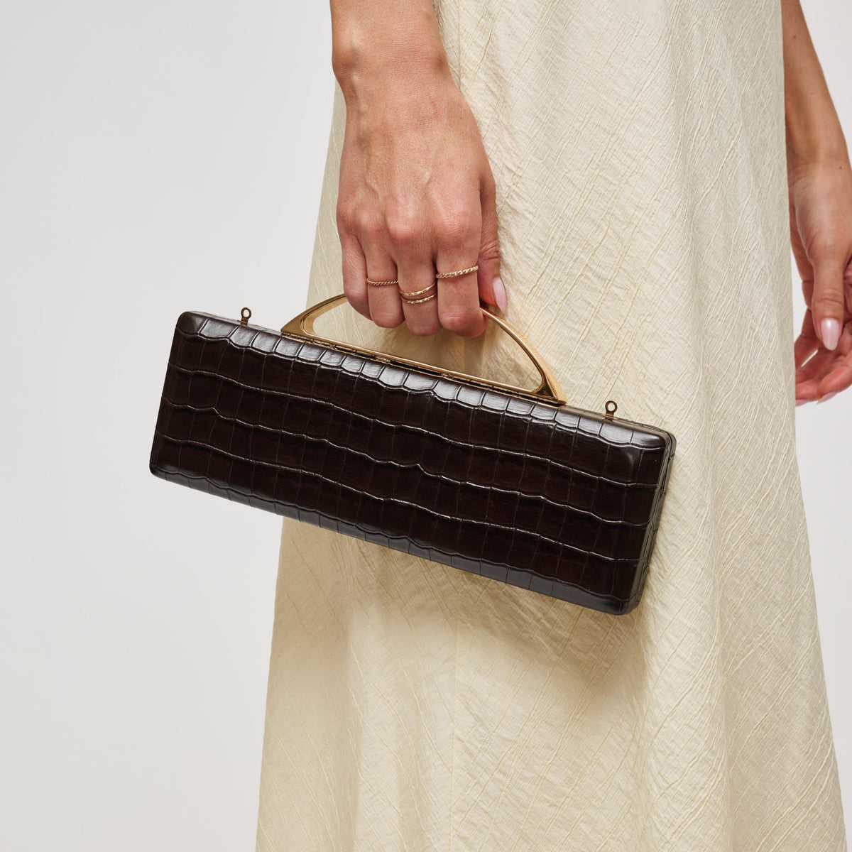 Woman wearing Chocolate Urban Expressions Banks Clutch 840504212055 View 1 | Chocolate