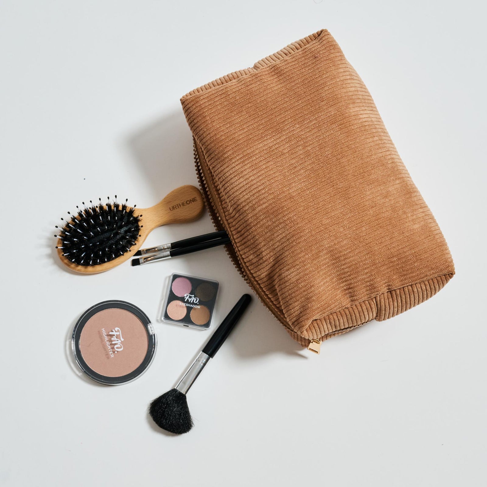 Woman wearing Cinnamon Urban Essentials Cordially Yours - Corduroy Cosmetic & Travel Organizer Pouch 840611196996 View 1 | Cinnamon