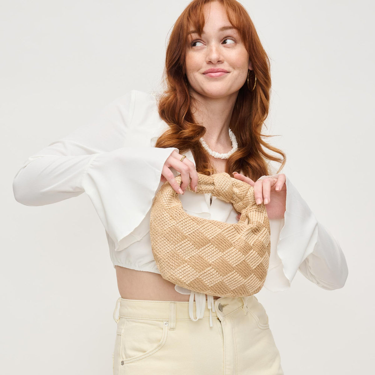 Woman wearing Natural Cream Urban Expressions Tracy - Love Knot Clutch 840611156570 View 2 | Natural Cream
