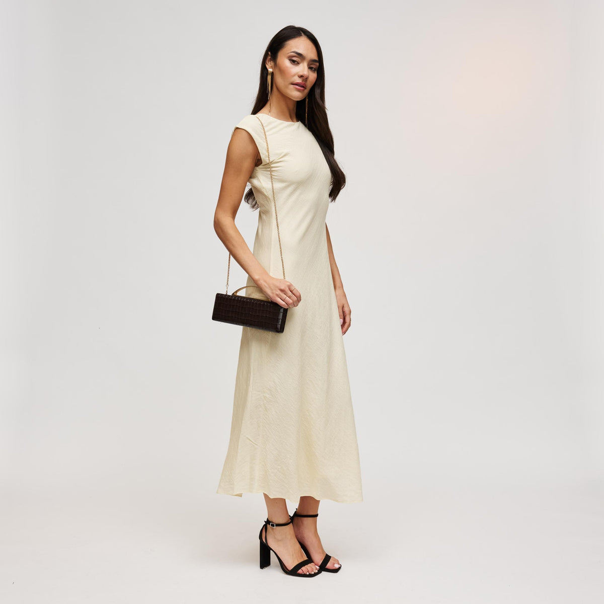 Woman wearing Chocolate Urban Expressions Banks Clutch 840504212055 View 4 | Chocolate