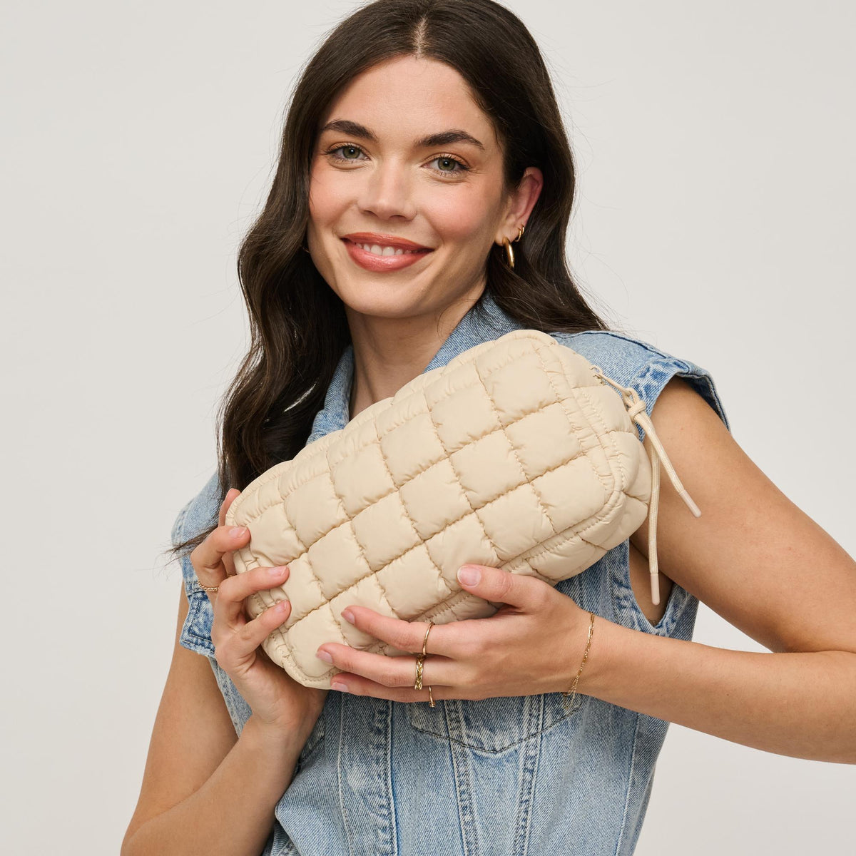 Woman wearing Cream Urban Essentials Cloud Nine - Puffer Cosmetic & Travel Organizer Pouch 840611143839 View 2 | Cream