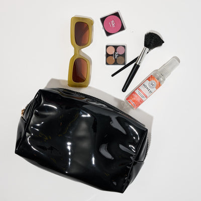 Woman wearing Black Urban Essentials Patent Pending Cosmetic & Travel Organizer Pouch 840611197290 View 1 | Black