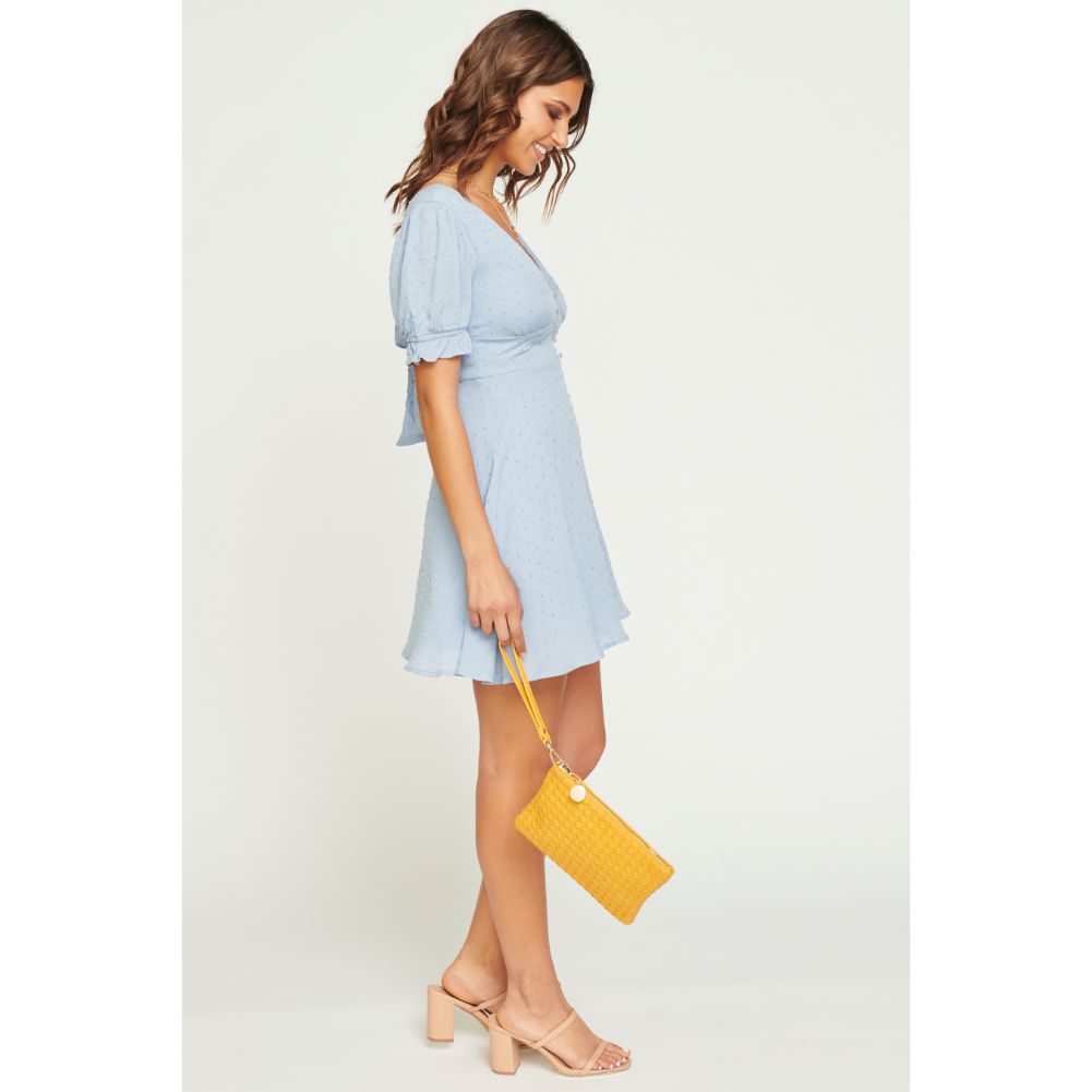 Woman wearing Mustard Urban Expressions Joan Wristlet NA-840611160478 View 2 | Mustard