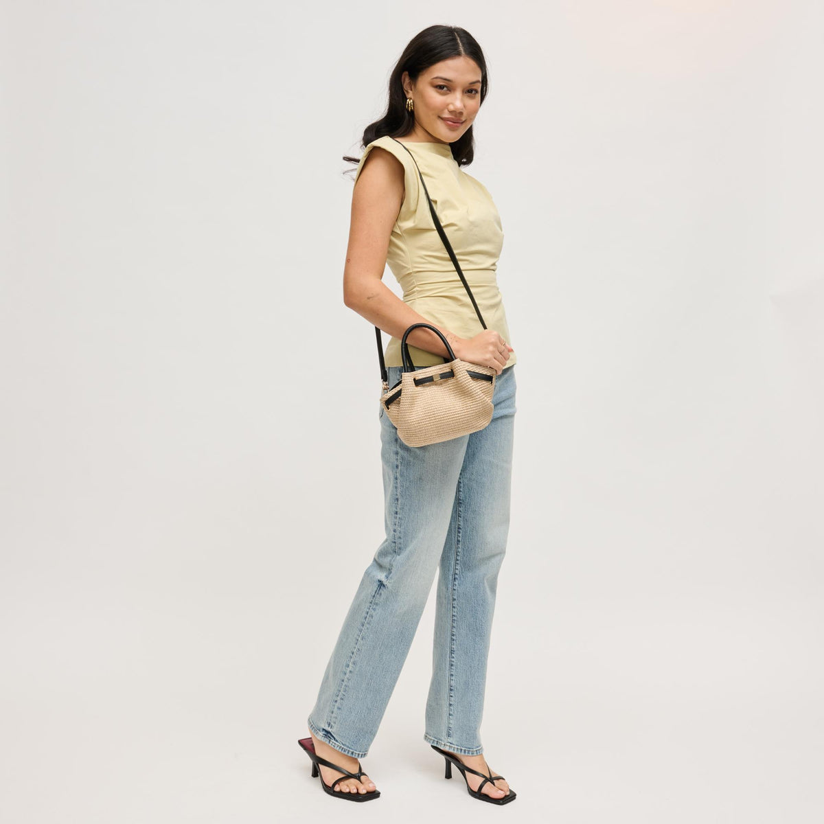 Woman wearing Natural Black Urban Expressions Selena - Straw Crossbody 840504204876 View 3 | Natural Black