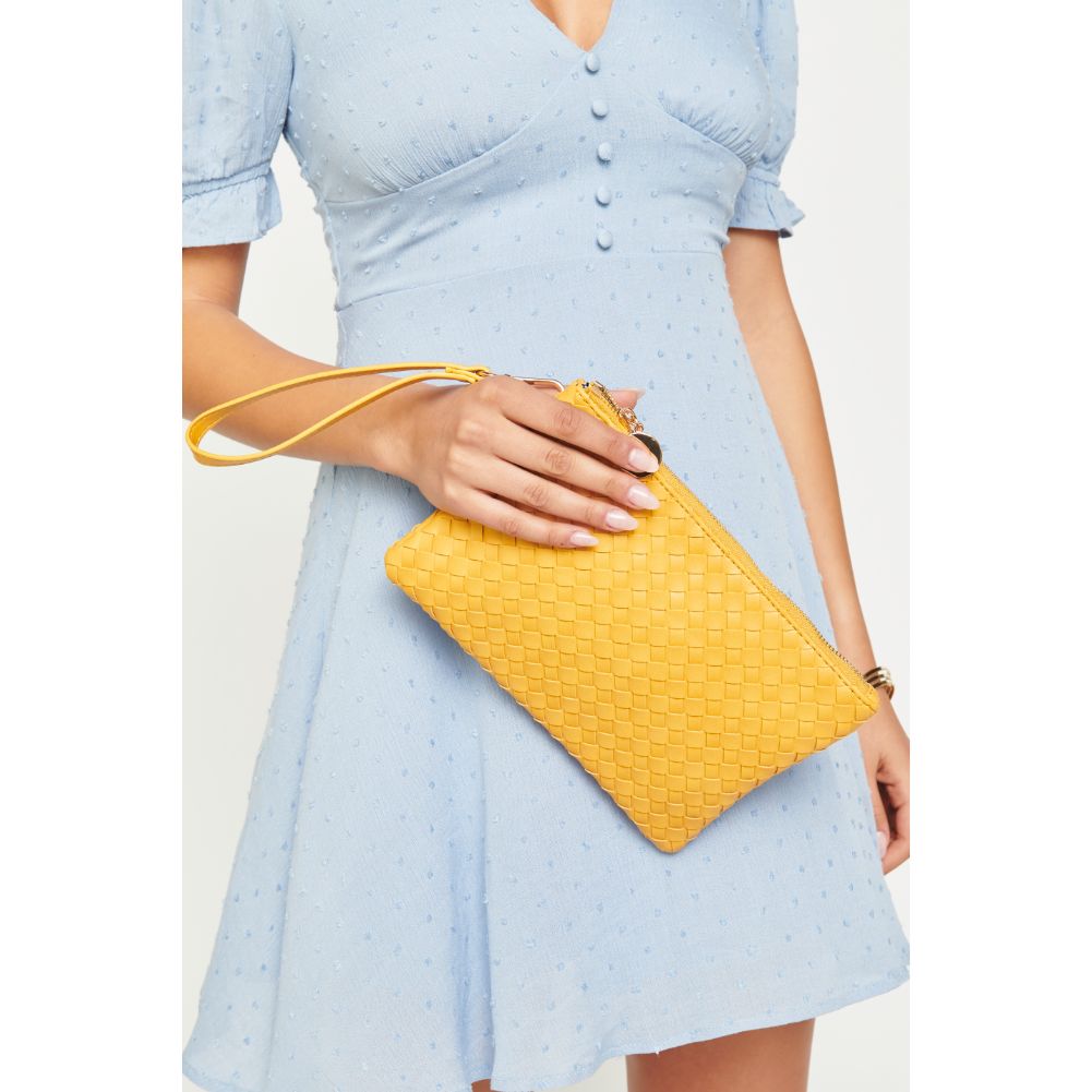 Woman wearing Mustard Urban Expressions Joan Wristlet NA-840611160478 View 1 | Mustard