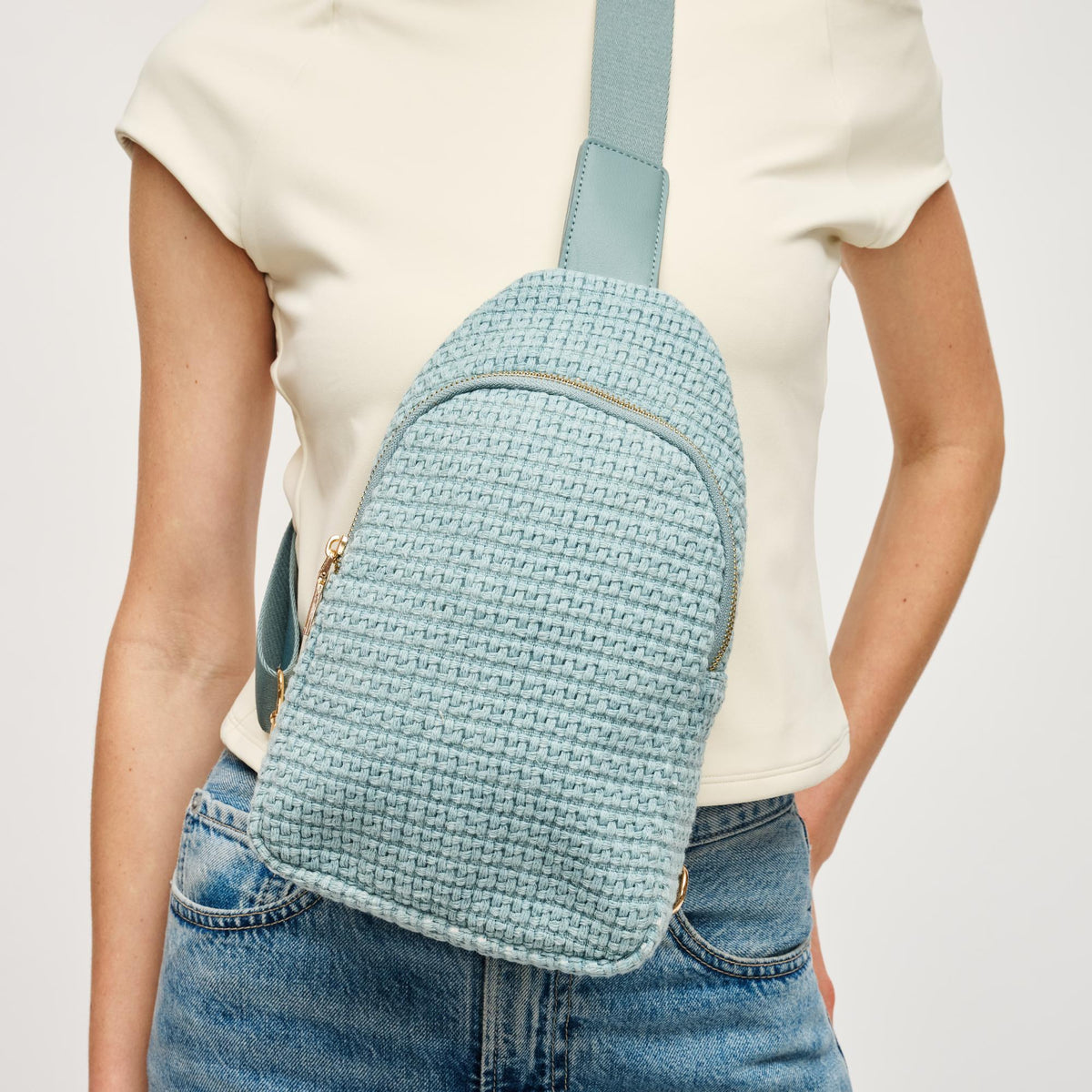 Woman wearing Blue Urban Expressions Jean Sling Backpack 840611146540 View 1 | Blue