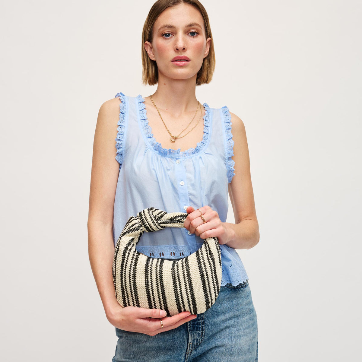 Woman wearing Black White Urban Expressions Tracy - Stripes Clutch 840611141651 View 2 | Black White