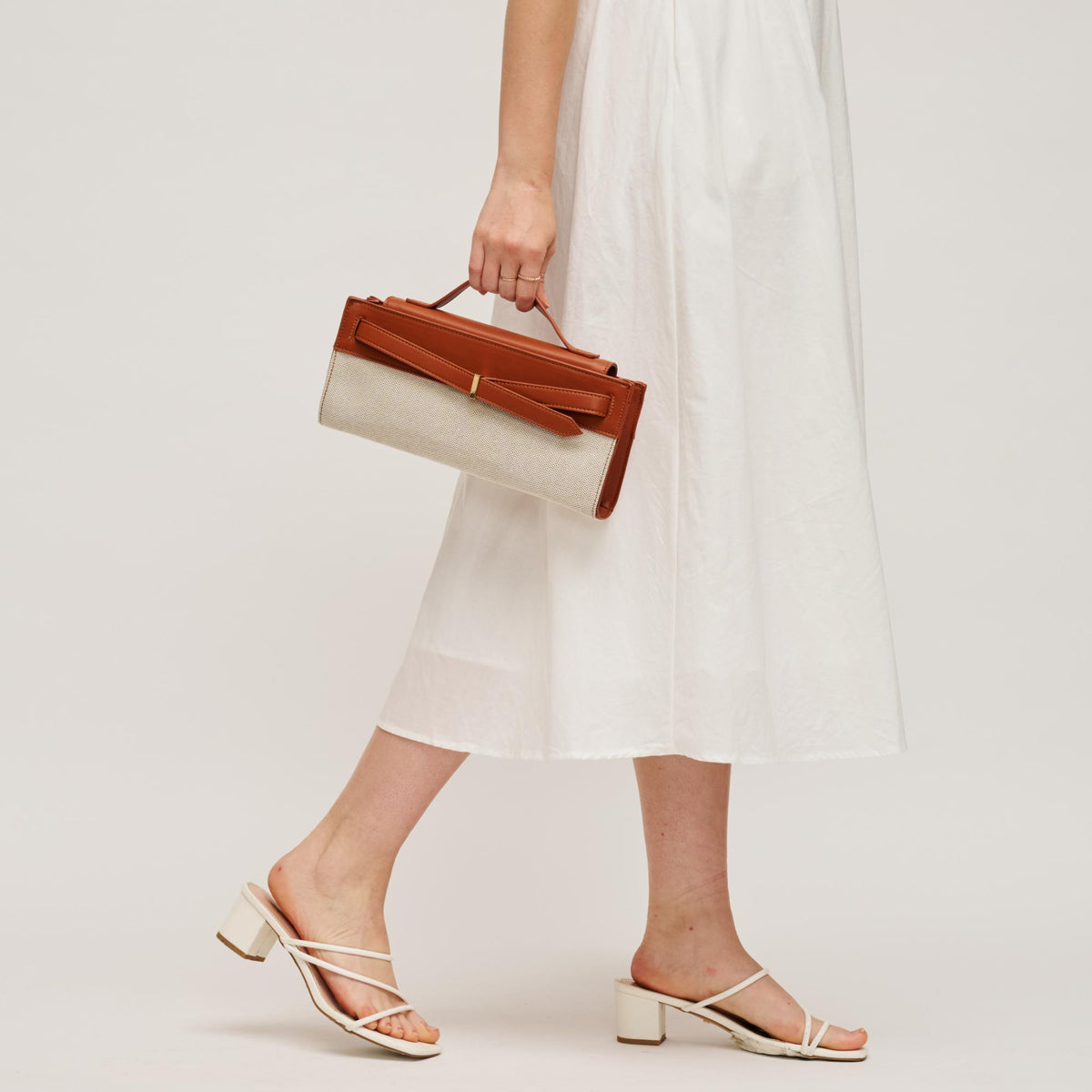 Woman wearing Ivory Tan Urban Expressions Emerly Clutch 840504205736 View 3 | Ivory Tan