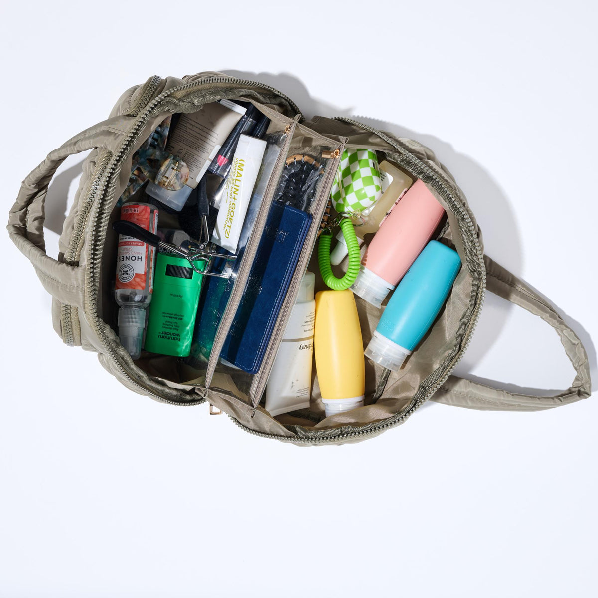 Woman wearing Desert Sage Urban Expressions Zip Me Pretty - Quilted Puffer Travel Organizer 840504201196 View 2 | Desert Sage