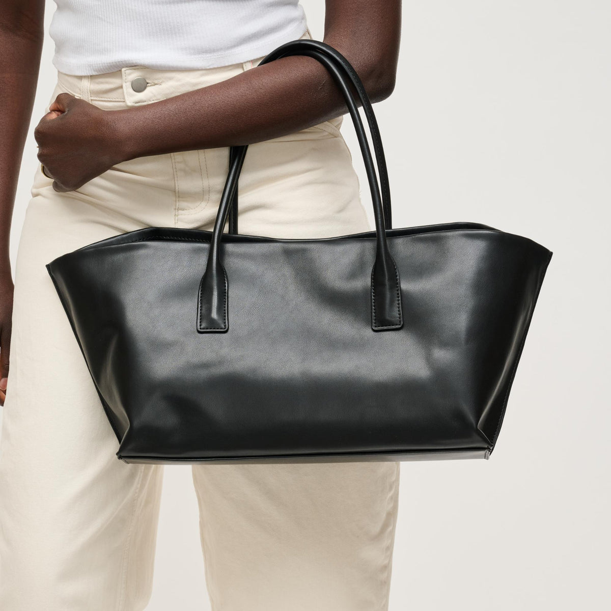 Woman wearing Black Urban Expressions Levi Tote 840504205255 View 1 | Black