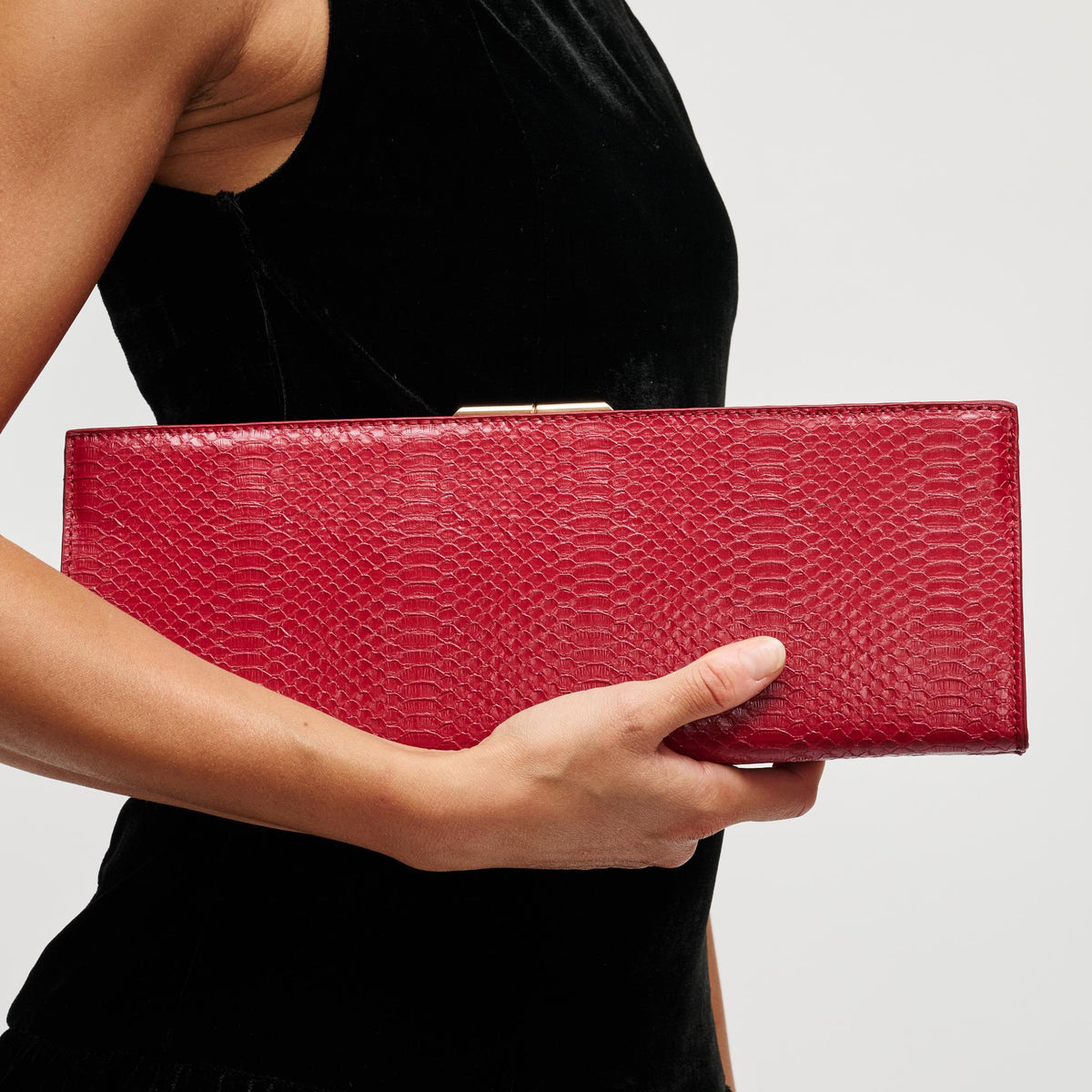 Woman wearing Red Urban Expressions Nazlee - Snake Clutch 840504212598 View 1 | Red