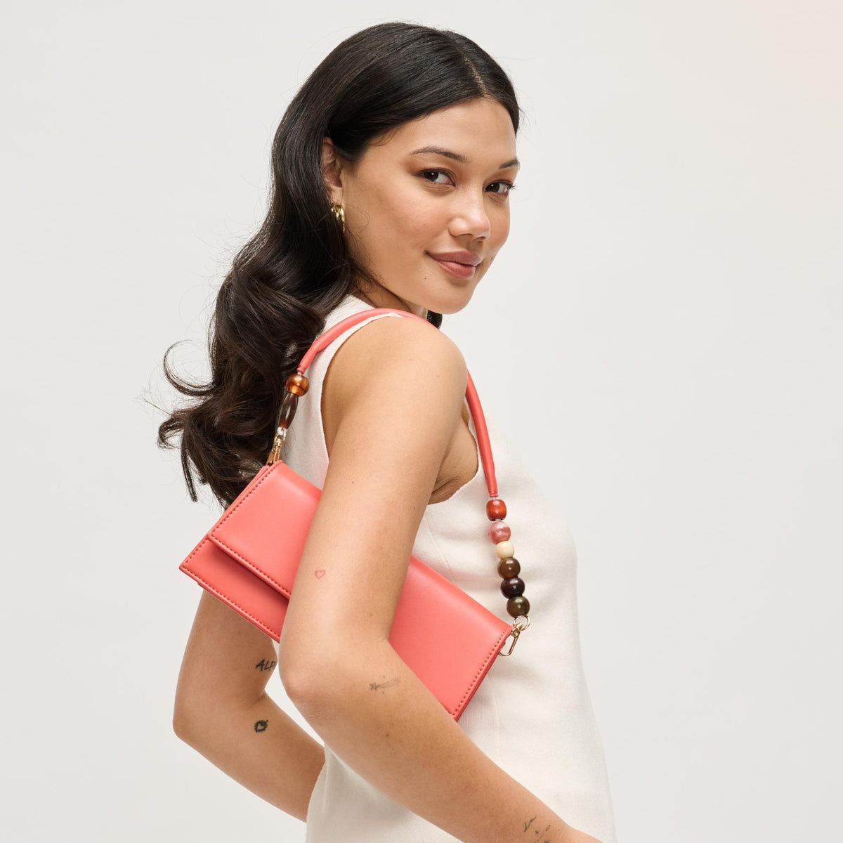 Woman wearing Coral Urban Expressions Brooks Crossbody 840504206658 View 4 | Coral