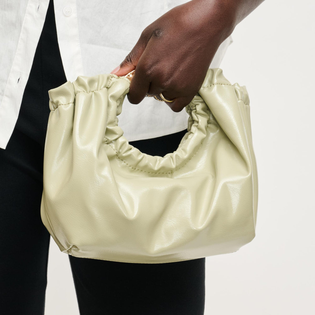 Woman wearing Sage Urban Expressions Myles Crossbody 840504204739 View 1 | Sage