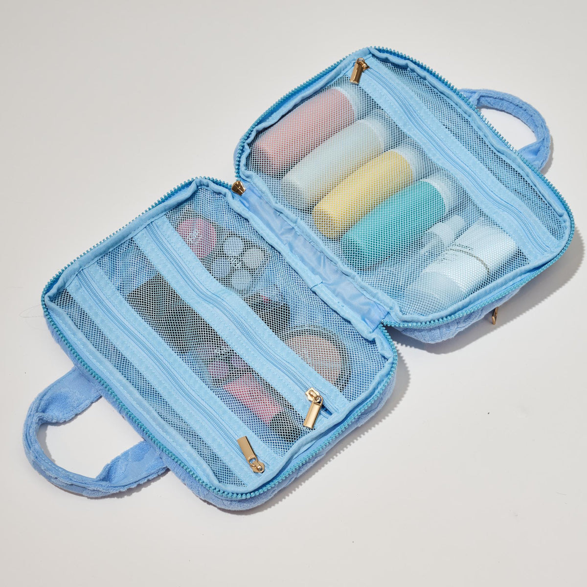 Woman wearing Light Blue Urban Essentials Tropical Dreams Travel Organizer 840611195227 View 2 | Light Blue