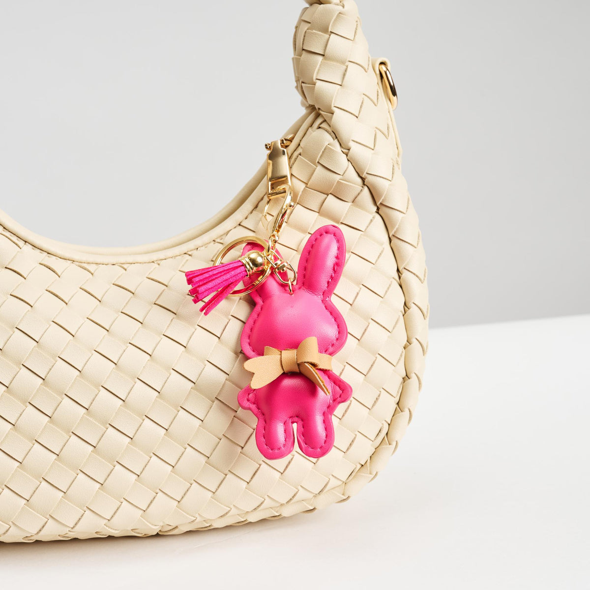 Woman wearing Pink Urban Expressions Bunnie Keychain Charm 840611150561 View 2 | Pink