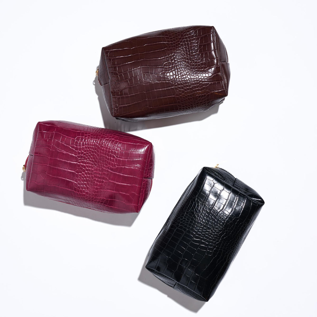 Woman wearing Chocolate Urban Essentials Croc Chic Cosmetic & Travel Organizer Pouch 840611197283 View 2 | Chocolate
