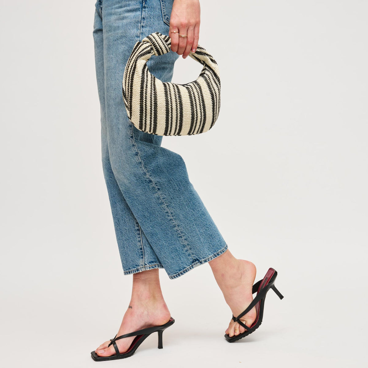 Woman wearing Black White Urban Expressions Tracy - Stripes Clutch 840611141651 View 4 | Black White