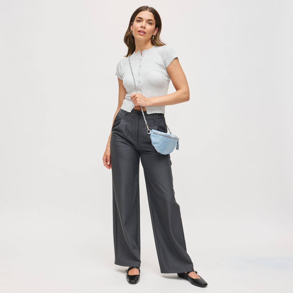 Woman wearing Blue Urban Expressions Lachlan - Quilted Belt Bag 840504200243 View 3 | Blue