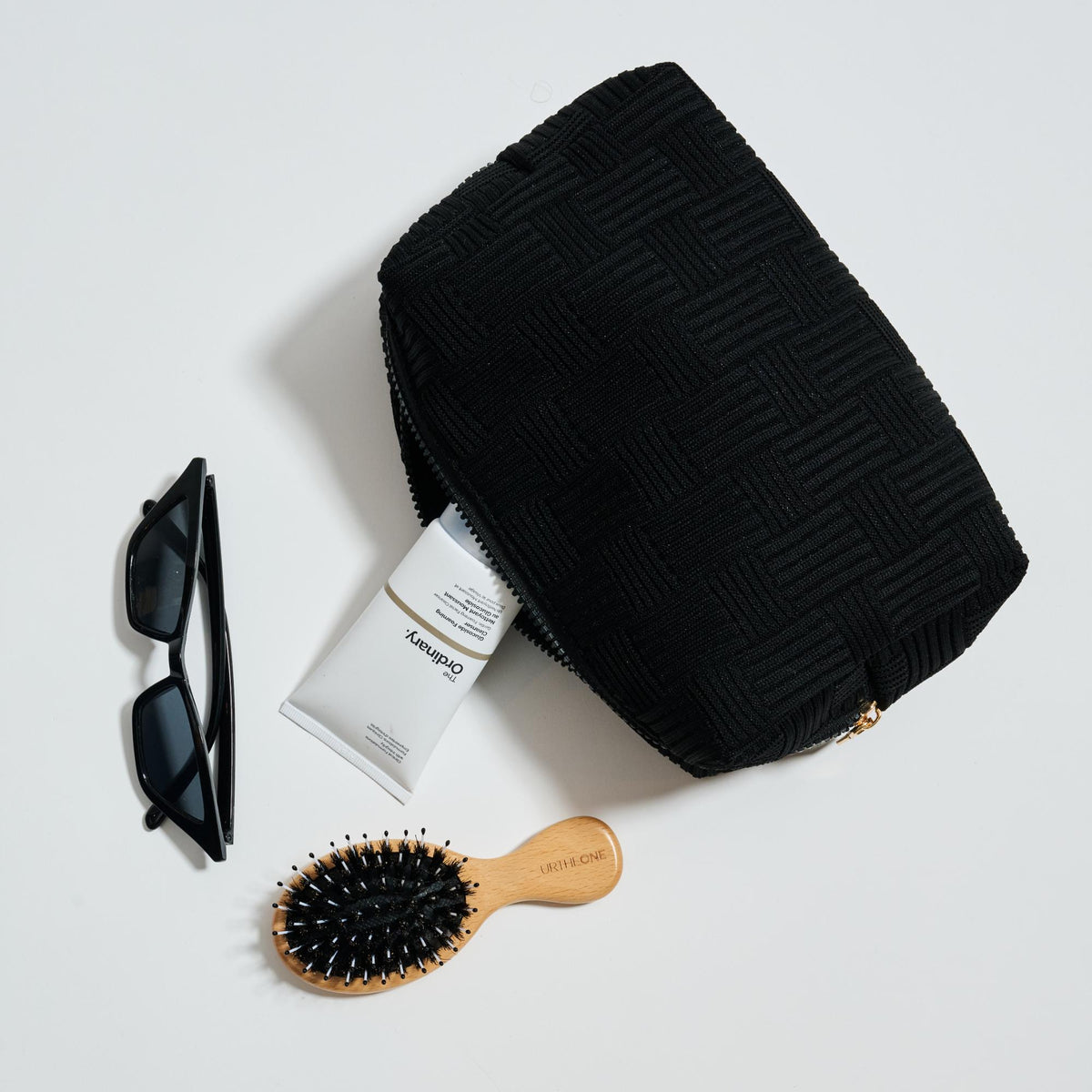 Woman wearing Black Urban Essentials Hatchway Cosmetic & Travel Organizer Pouch 840611197740 View 1 | Black