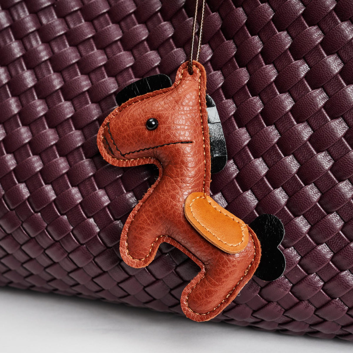 Woman wearing Brown Urban Expressions Horse Hanging Charm 840611150776 View 1 | Brown
