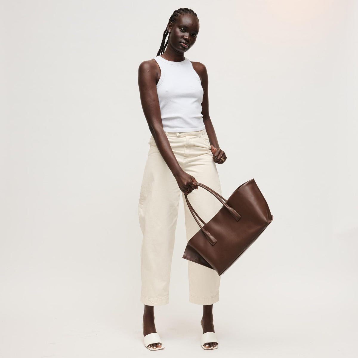 Woman wearing Chocolate Urban Expressions Levi Tote 840504205262 View 4 | Chocolate