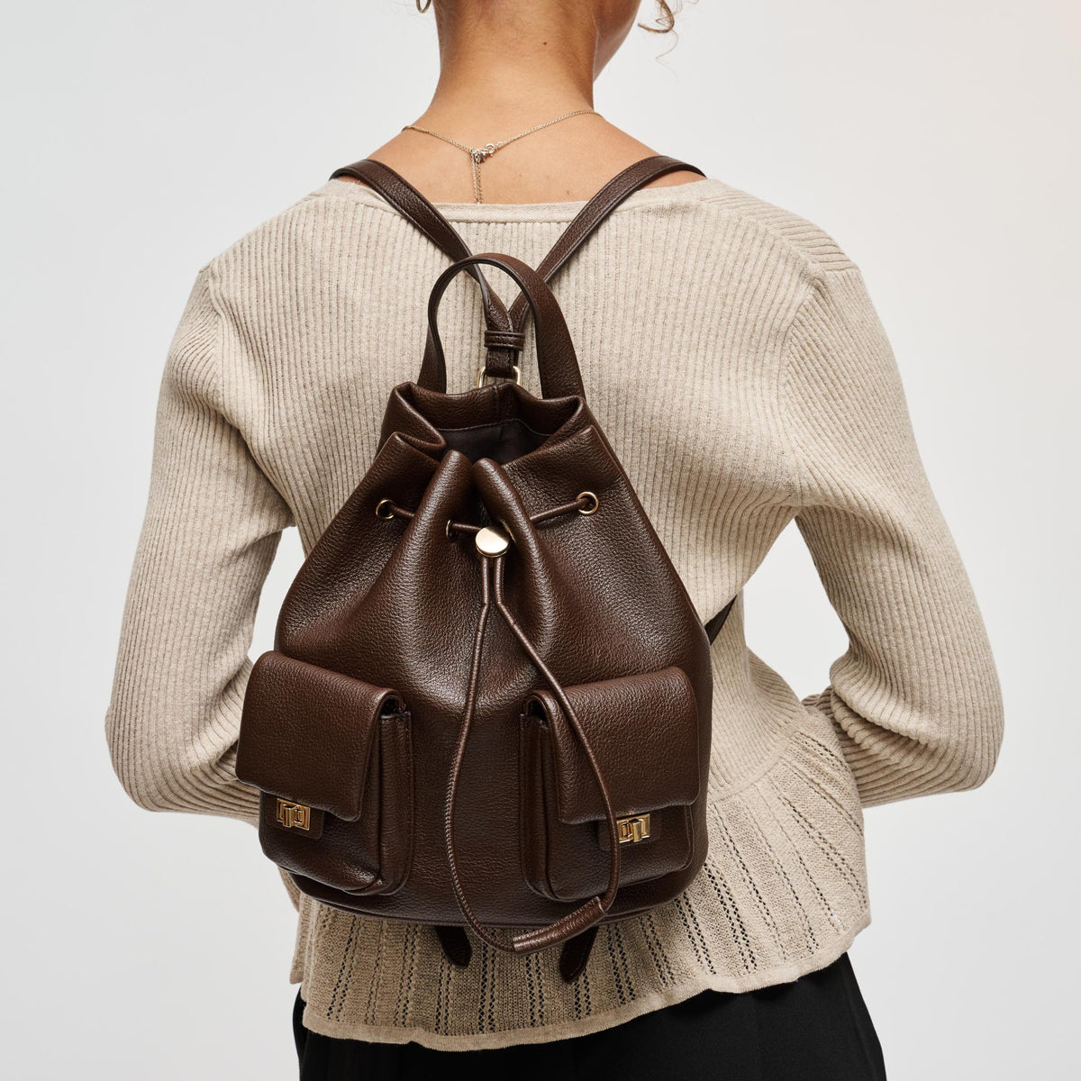 Woman wearing Espresso Urban Expressions Clearfield Backpack 840504212376 View 1 | Espresso