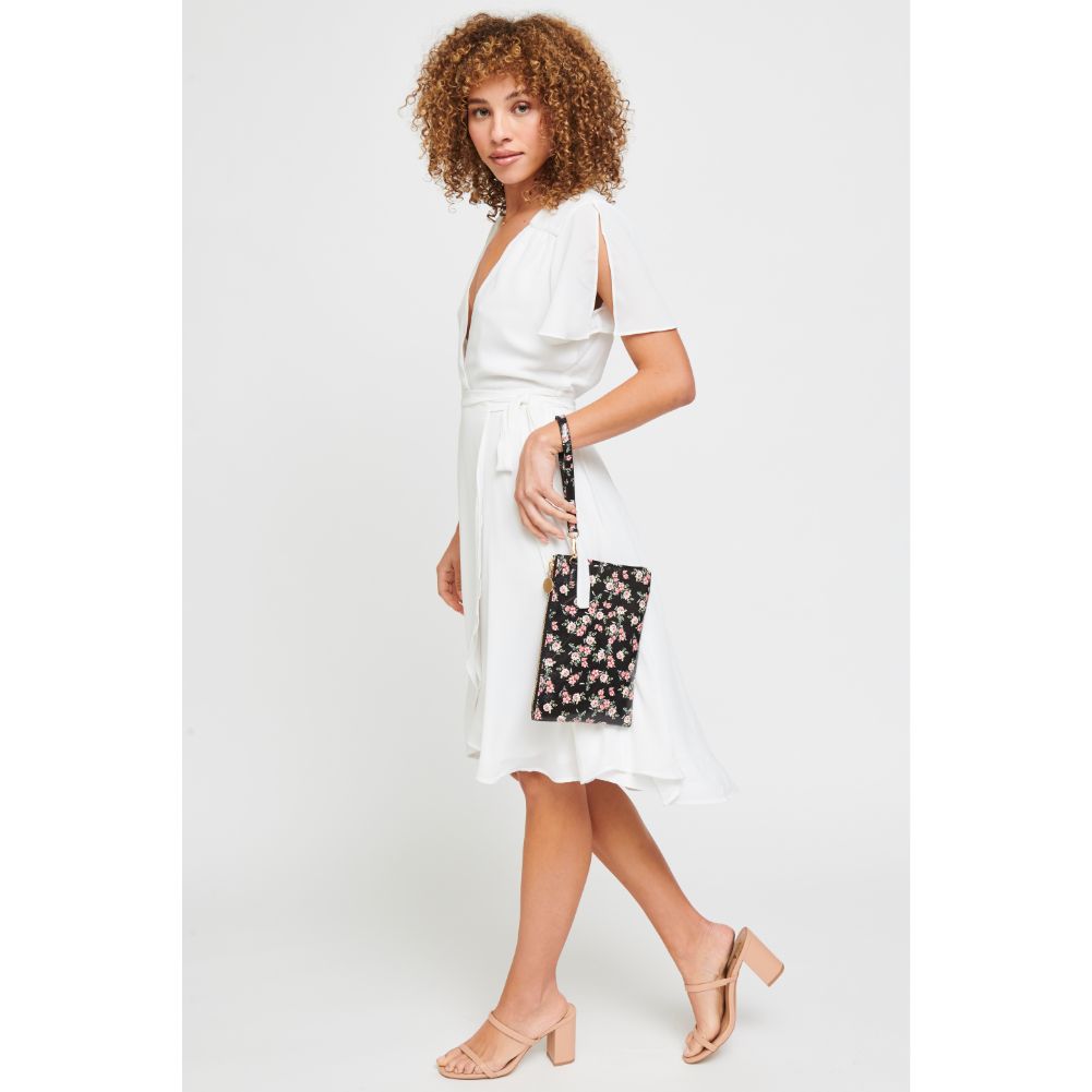 Woman wearing Black Urban Expressions Joan Floral Wristlet 840611181121 View 2 | Black