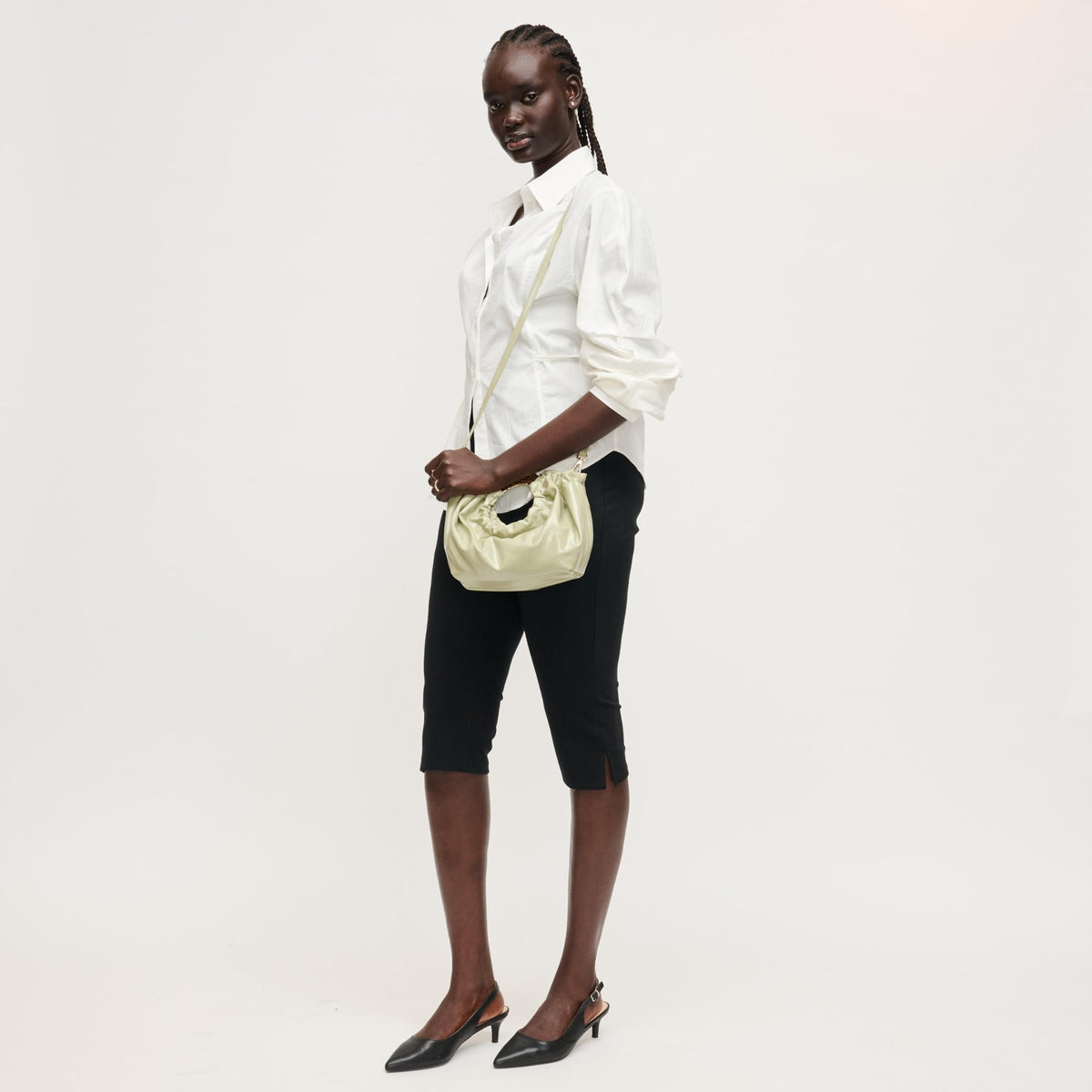 Woman wearing Sage Urban Expressions Myles Crossbody 840504204739 View 2 | Sage
