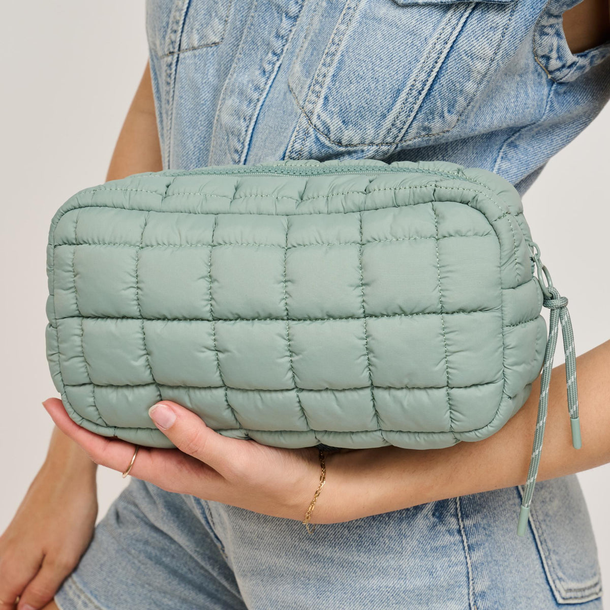 Woman wearing Sage Urban Expressions Cloud Nine - Quilted Puffer Nylon Cosmetic Pouch 840611143808 View 2 | Sage
