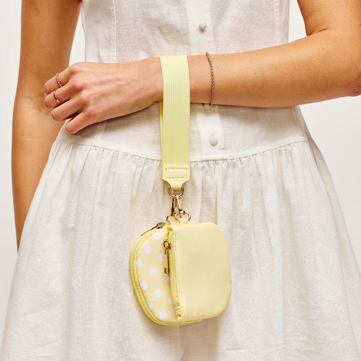 Woman wearing Yellow Urban Expressions Link & Carry - Polka Dot Wristlet 840504202711 View 2 | Yellow