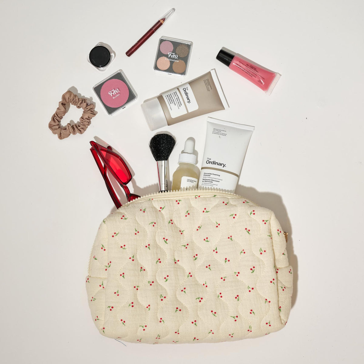 Woman wearing Cherry Urban Essentials Quilted Keeper Cosmetic & Travel Organizer Pouch 840611195449 View 2 | Cherry