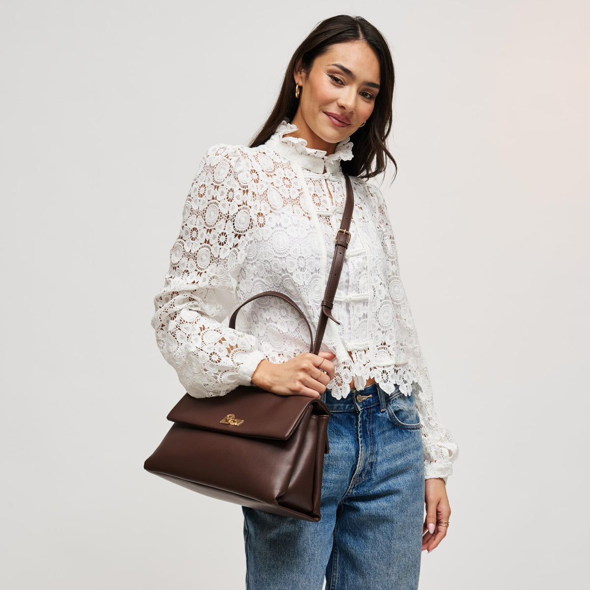 Woman wearing Espresso Urban Expressions Arrow Satchel 840504212932 View 3 | Espresso