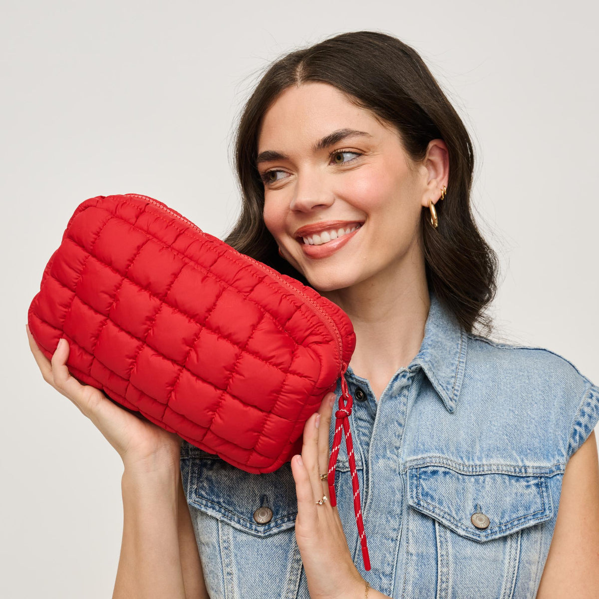 Woman wearing Red Urban Essentials Cloud Nine - Puffer Cosmetic & Travel Organizer Pouch 840611143815 View 2 | Red