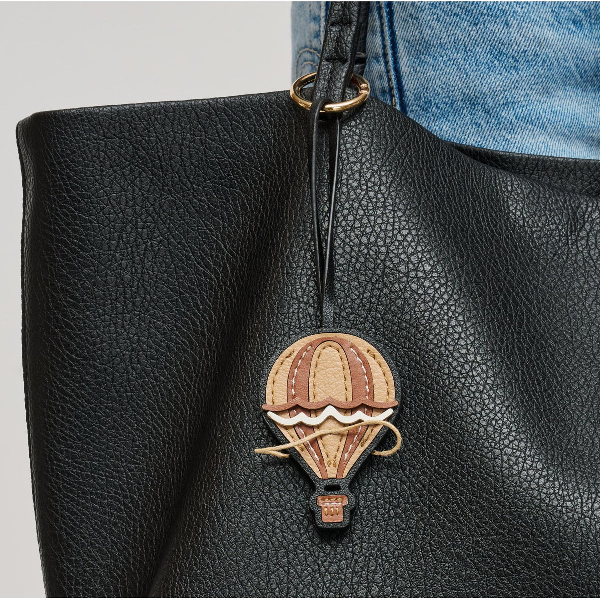 Woman wearing Tan Urban Expressions Helium Keychain Charm 840504201097 View 1 | Tan