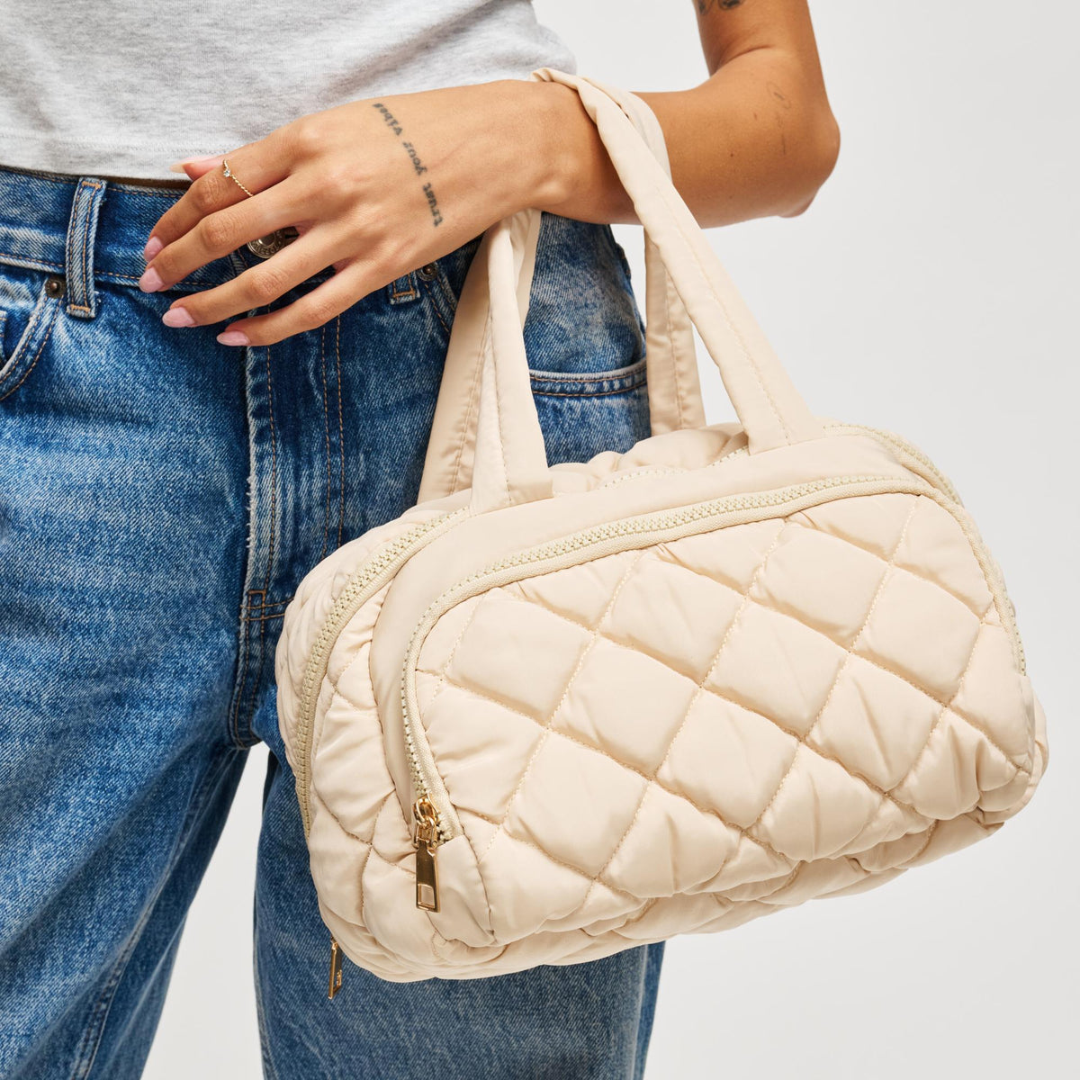 Woman wearing Cream Urban Essentials Zip Me Pretty - Quilted Puffer Travel Organizer 840504201189 View 1 | Cream