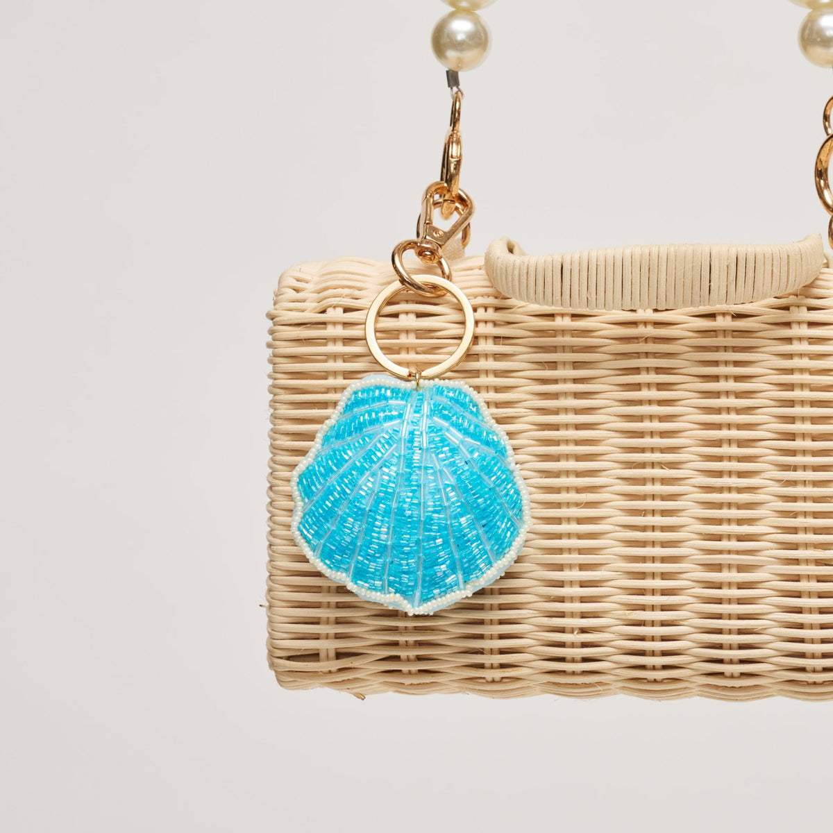 Woman wearing Blue Urban Expressions Shell Keychain Charm 840504209208 View 2 | Blue
