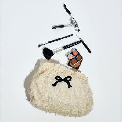 Woman wearing Cream Black Urban Essentials Fluffette Cosmetic & Travel Organizer Pouch 840611197245 View 1 | Cream Black