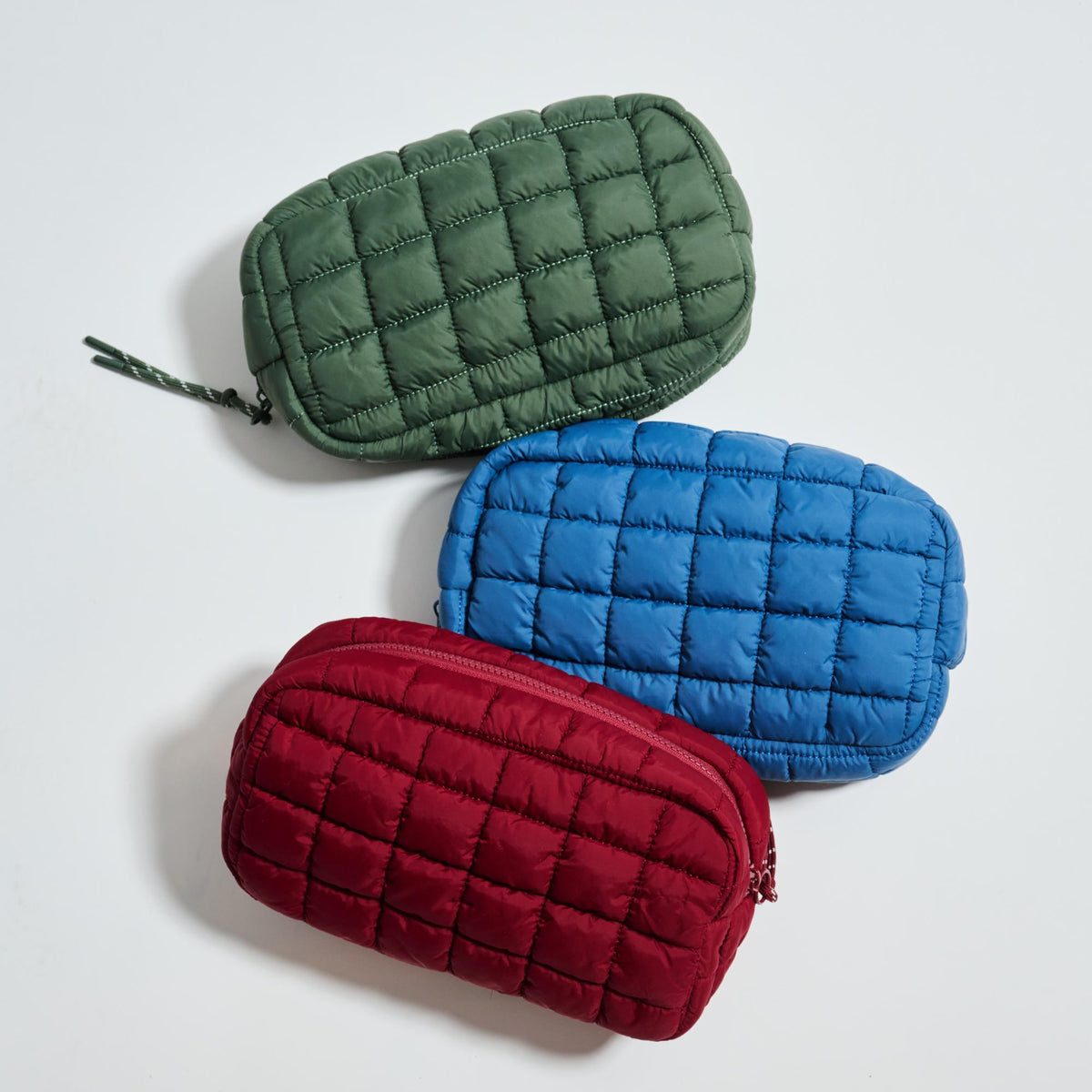 Woman wearing Burgundy Urban Essentials Cloud Nine - Puffer Cosmetic & Travel Organizer Pouch 840611197719 View 2 | Burgundy