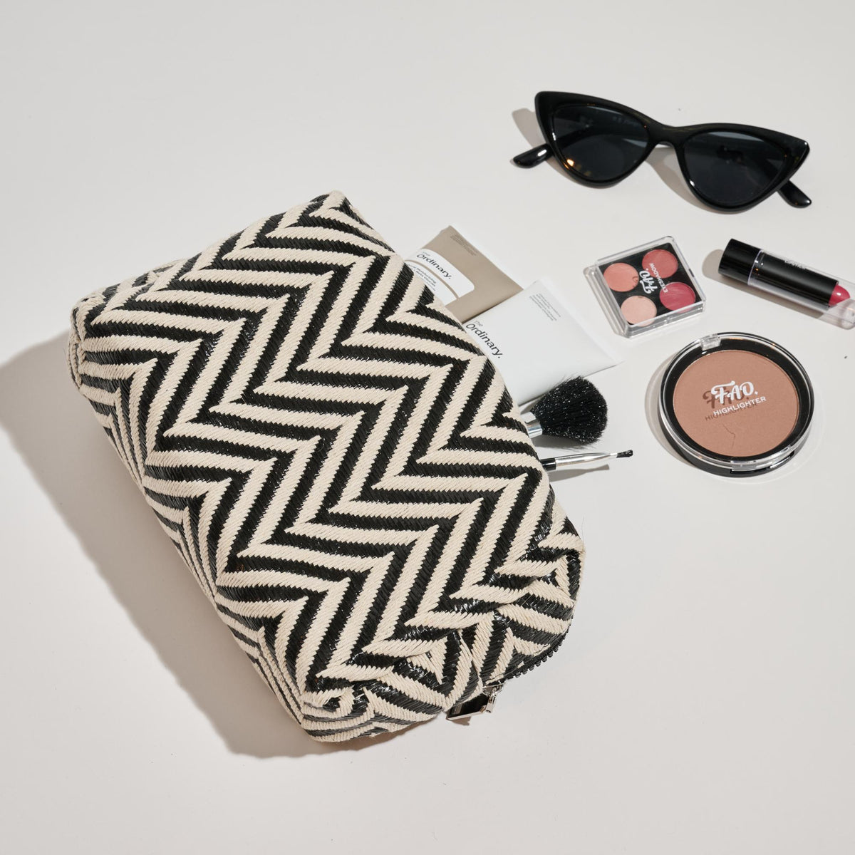Woman wearing Black White Urban Essentials Chevron Chic Cosmetic & Travel Organizer Pouch 840611152633 View 1 | Black White