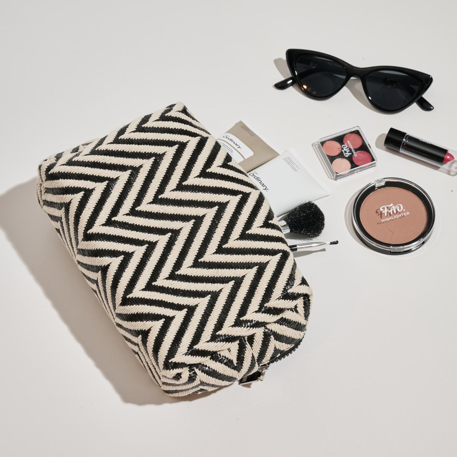 Woman wearing Black White Urban Essentials Chevron Chic Cosmetic & Travel Organizer Pouch 840611152633 View 1 | Black White